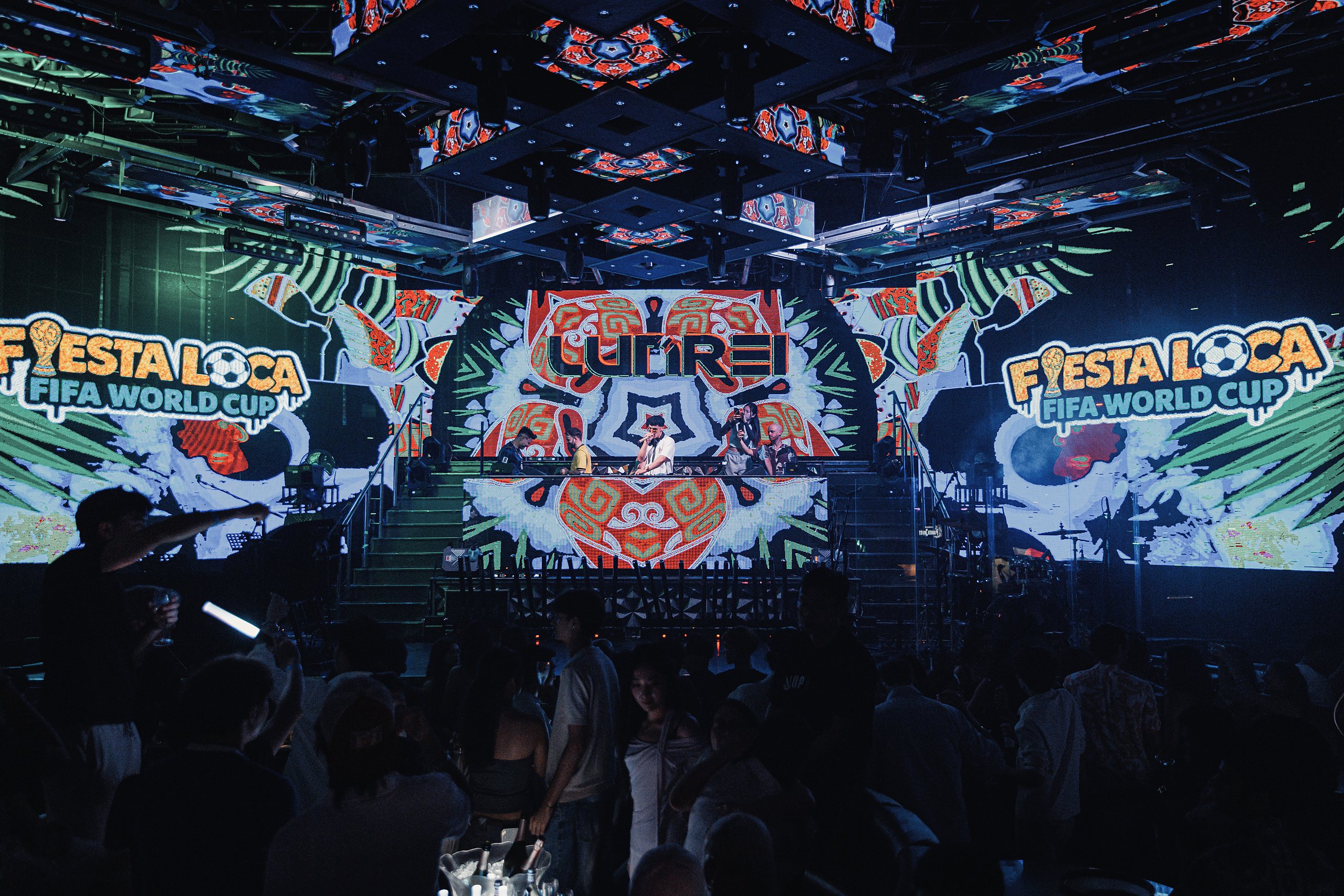 LUNREI on stage in Macau under a wall of LED screens